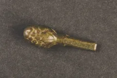 This is a “strawberry” knob spoon handle top, dating from c. 1600-1625. It is unusual because most latten spoons commonly had “seal tops,” with a flat terminal end.
