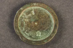 This small bronze weight was used for weighing items on a scale. Steelyards are a portable weighing scale with a graduated beam, weight, and hooks.